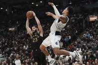 Toronto Raptors' Fred VanVleet, left, claims a defensive rebound in front of Dallas Mavericks' Josh Green during second-half NBA basketball game action in Toronto, Saturday, Nov. 26, 2022. (Chris Young/The Canadian Press via AP)