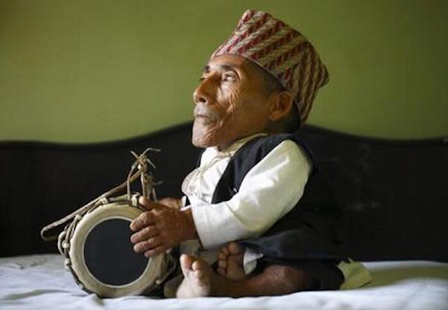 World's shortest man, Chandra Dangi, playing handdrum (Photo: Gwrthanesh via Wikimedia Commons)