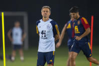 Spain's head coach Luis Enrique looks on as his team works out during a training session at Qatar University, in Doha, Qatar, Friday, Dec. 2, 2022. Spain will play against Morocco in the round of 16 knockout round of the World Cup soccer tournament on Dec. 6. (AP Photo/Julio Cortez)