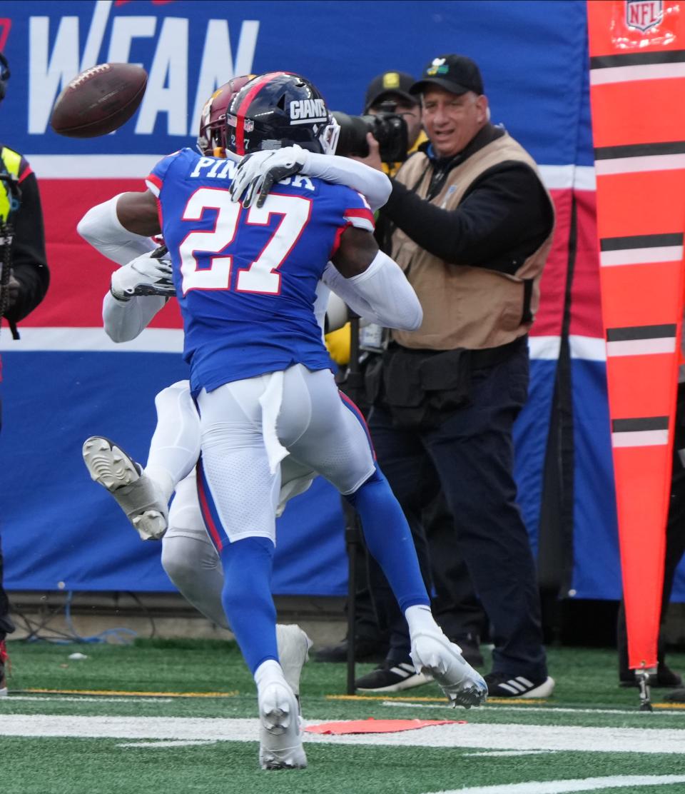 East Rutherford, NJ — October 22, 2023 -- Jahan Dotson of the Commanders has a pass to him broken up by Jason Pinnock of the Giants on a fourth down play that sealed the game for the Giants. The NY Giants host the Washington Commanders at MetLife Stadium in East Rutherford, NJ on October 22, 2023.