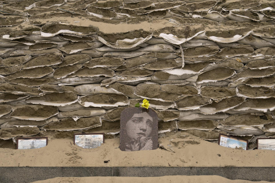 The statue of Grand Princess Olga of Kyiv is covered in sandbags to avoid potential shelling damage, in Kyiv, Ukraine, Friday, March 3, 2023. (AP Photo/Vadim Ghirda)