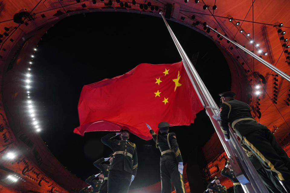 The Chinese national flag is raised during the opening ceremony of the 2022 Winter Olympics, Feb. 4, 2022, in Beijing. (AP Photo/Natacha Pisarenko, file)