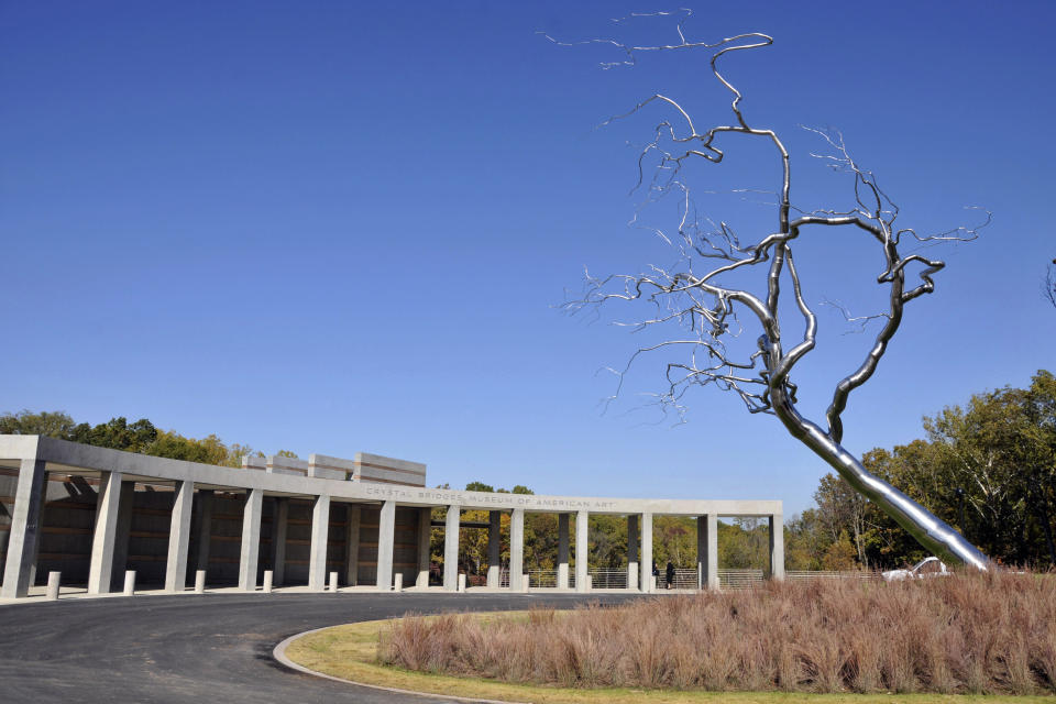 FILE - This Monday, Oct. 24, 2011 file photo shows the entrance to the Crystal Bridges Museum of American Art in Bentonville, Ark. Nearly four months after opening in November, the museum has already had over 175,000 visitors. (AP Photo/April L. Brown)