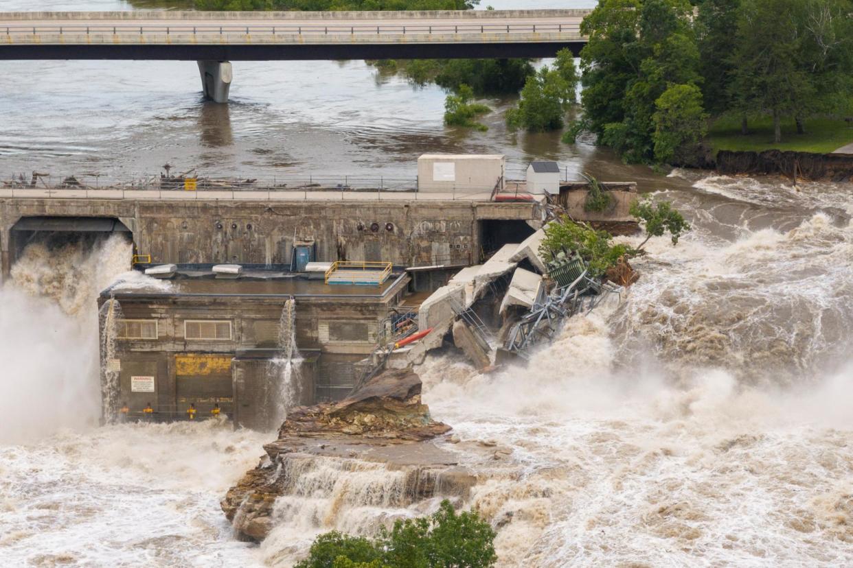 <span>Debris accumulates on the Rapidan dam after torrential rains caused the Blue Earth River to flood near Mankato, Minnesota, on 25 June 2024.</span><span>Photograph: Ben Brewer/Reuters</span>