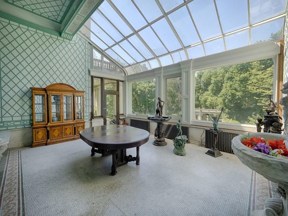 Shown here is the sunroom, one of the mansion's 56 rooms.