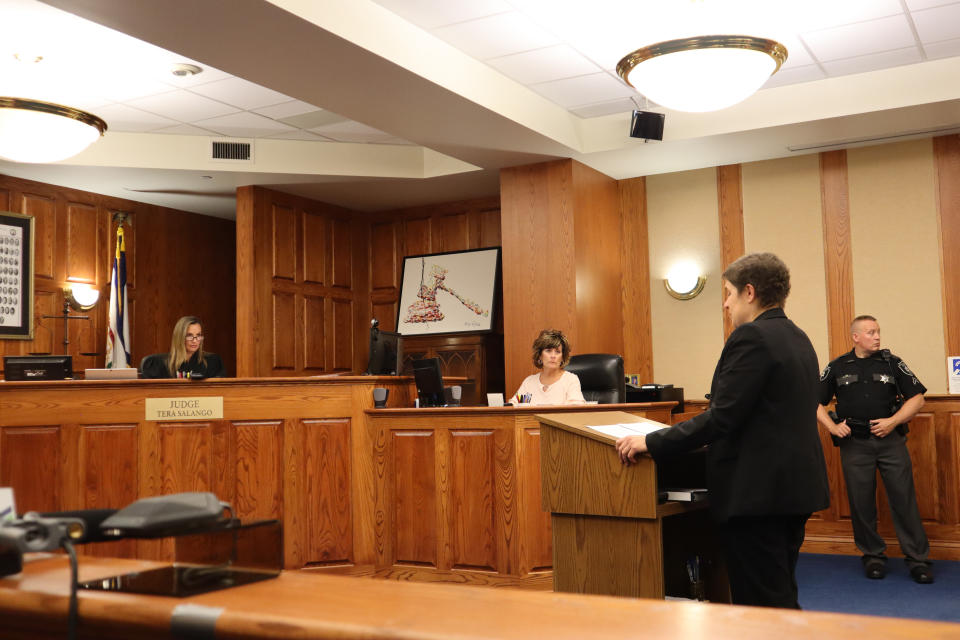 Judge Tera L. Salango, left, listens from the bench as attorney Kathleen Hartnett, of Cooley Law, speaks in support of West Virginia's only abortion clinic in Kanawha County Circuit Court in Charleston, W.Va., on Monday, July 18, 2022. Salango granted the Women’s Health Center of West Virginia a preliminary injunction against the state's 1800s-era abortion ban. (AP Photo/Leah Willingham)