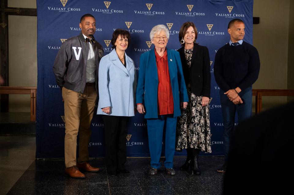 Valiant Cross founders Anthony Brock, left, Fredrick Brock, right, Jeanne Allen, CEO of Yass Prize, middle left, Janine Yass, middle right, and Gov. Kay Ivey pose for a photo during the Yass Prize award ceremony at Valiant Cross Academy’s Middle School Campus in Montgomery.