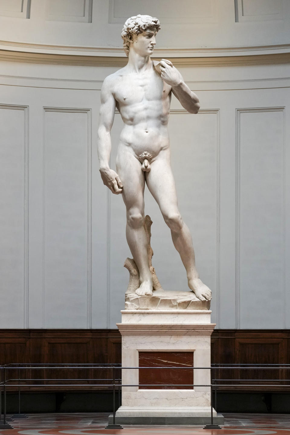 Michelangelo's 16th century statue of David is seen on display at the Accademia gallery, in Florence, central Italy, Monday, March 18, 2024. Michelangelo’s David has been a towering figure in Italian culture since its completion in 1504. But curators worry the marble statue’s religious and political significance is being diminished by the thousands of refrigerator magnets and other souvenirs focusing on David’s genitalia. The Galleria dell’Accademia’s director has positioned herself as David’s defender and takes swift aim at those profiteering from his image. (AP Photo/Andrew Medichini)