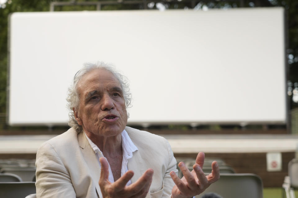 Director Abel Ferrara answers to a journalist's question during an interview with the Associated Press on his latest movie "Padre Pio" in Rome, Tuesday, Aug. 23, 2022. Abel Ferrara, whose gritty New York exploitation films of the 1980s and 1990s delved into the soulless evils of drug addiction, corruption and sexual violence, pays homage to one of Italy’s best-known and most revered saints in his newest film, “Padre Pio.” (AP Photo/Gregorio Borgia)