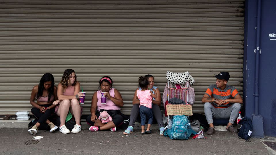 A group of Venezuelan migrants ask for money to continue their journey to the United States in San Jose, Costa Rica, on October 13, 2022. - Ezequiel Becerra/AFP/Getty Images/FILE