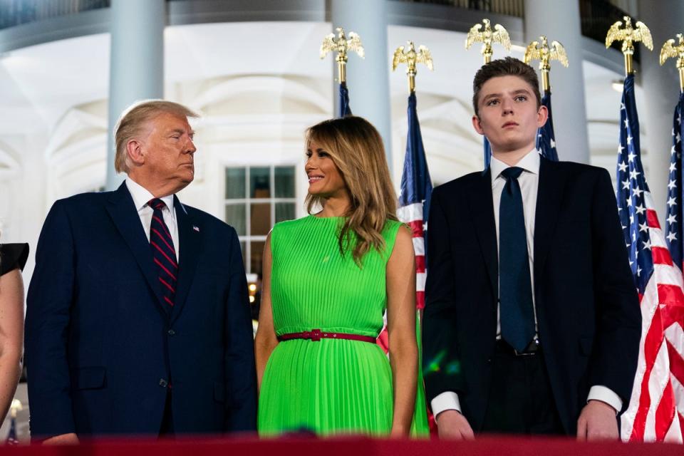 Donald Trump with then-first lady Melania Trump and their son Barron as the former delivered his acceptance speech for the Republican presidential nomination on the South Lawn of the White House on 27 August 2020 (AP)