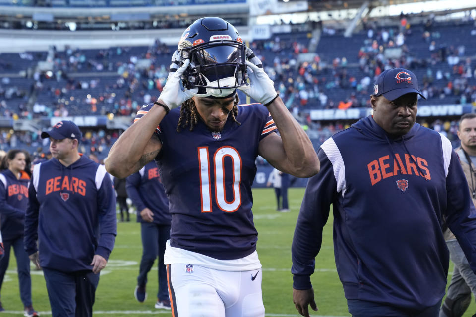 Chicago Bears wide receiver Chase Claypool (10) removes his helmet as he walks off the field after the Miami Dolphins beat the Bears 35-32 in an NFL football game, Sunday, Nov. 6, 2022 in Chicago. (AP Photo/Nam Y. Huh)
