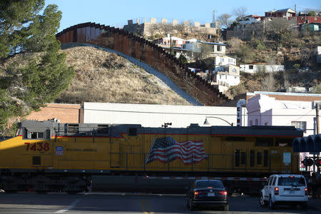 A freight train crosses into the U.S. across the border with Mexico in Nogales, Arizona, U.S., January 31, 2017. REUTERS/Lucy Nicholson