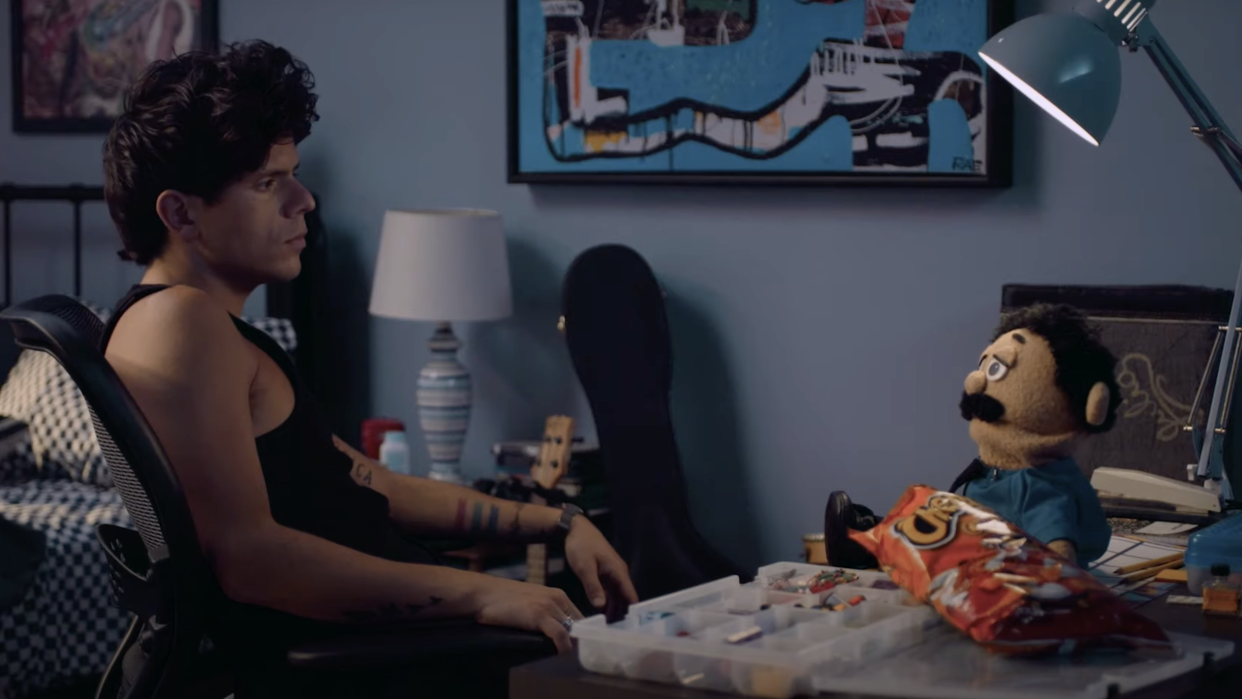  A still from the trailer for the upcoming Prime Video movie Musica in which actor and internet star Rudy Mancuso is sat opposite a puppet. 