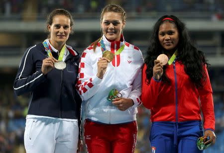 2016 Rio Olympics - Athletics - Victory Ceremony - Women's Discus Throw Victory Ceremony - Olympic Stadium - Rio de Janeiro, Brazil - 16/08/2016. Sandra Perkovic (CRO) of Croatia, Melina Robert-Michon (FRA) of France and Denia Caballero (CUB) of Cuba pose with their medals. REUTERS/Edgard Garrido