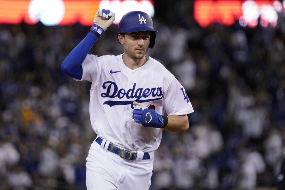 Dodgers' Trea Turner celebrates as he runs the bases on a solo home run against the San Diego Padres.