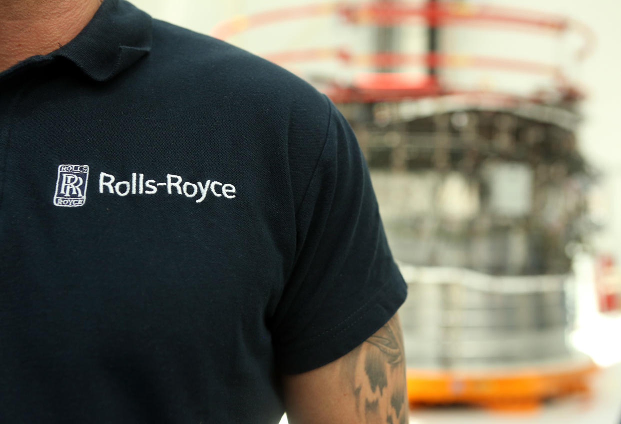 BERLIN, GERMANY - JUNE 14: An employee stands on the assembly line for the Rolls-Royce Trent XWB airplane engine, to be used in the Airbus A350 XWB aircraft, on June 14, 2017 in Berlin, Germany. The company says that the XWB, which stands for 'Extra Wide Body,' is one of the most fuel-efficient jet engines in the world and among the most quiet in its category, and costs around $20 million (18 million euros). The engine, whose data connectivity allows for better monitoring over previous models, entered commercial service in January 2015.  (Photo by Adam Berry/Getty Images)