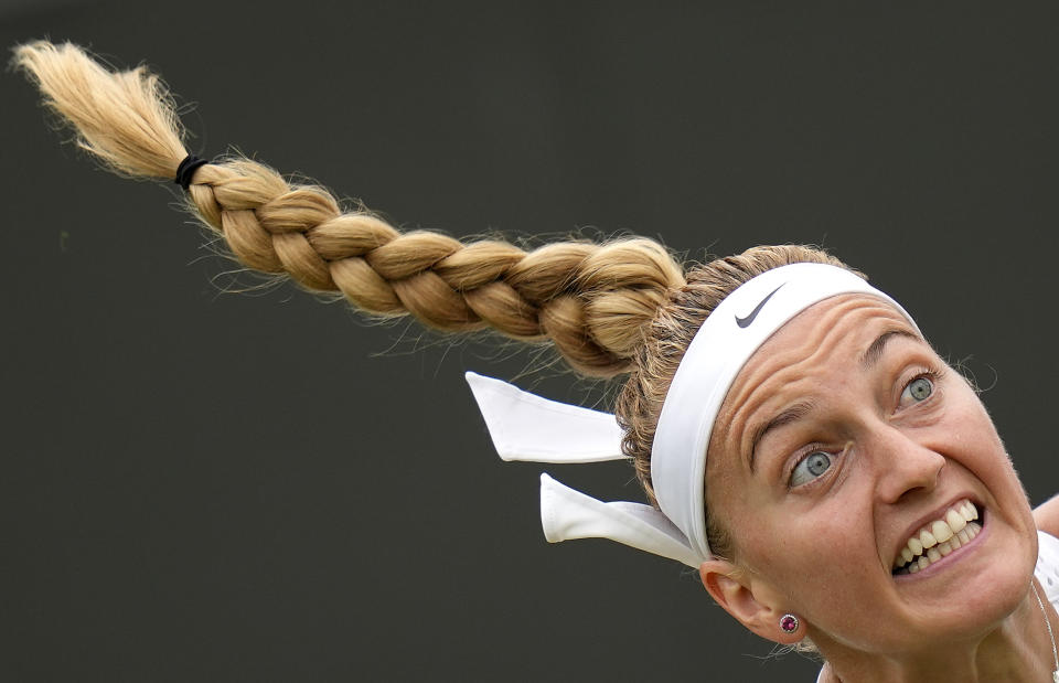 Czech Republic's Petra Kvitova serves to Serbia's Natalija Stevanovic in a women's singles match on day six of the Wimbledon tennis championships in London, Saturday, July 8, 2023. (AP Photo/Kirsty Wigglesworth)