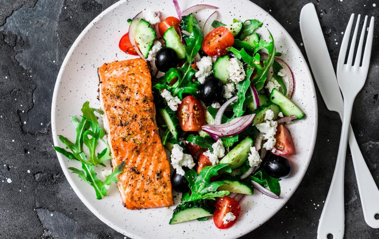 Mediterranean diet fresh fish and salad - OksanaKiian/iStockphoto