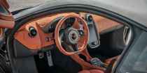 <p>The steering wheel in <a href="https://www.caranddriver.com/mclaren/570s-570gt" rel="nofollow noopener" target="_blank" data-ylk="slk:the McLaren 570S;elm:context_link;itc:0;sec:content-canvas" class="link ">the McLaren 570S</a> looks great, and its lack of buttons make it easy to focus on driving rather than fiddling with infotainment controls. </p>