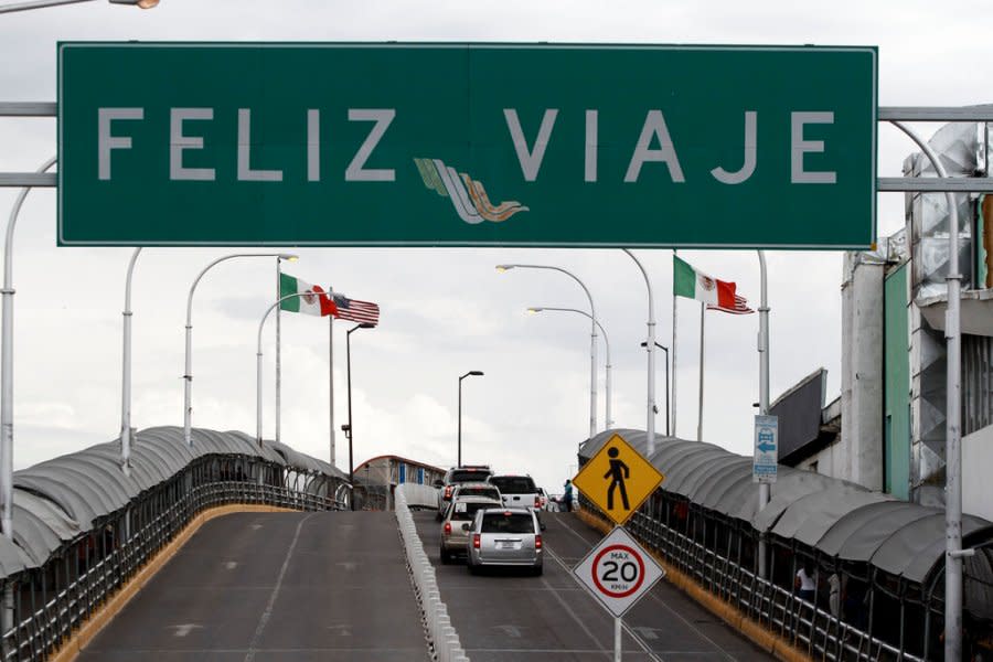 A “Happy travels” sign hangs at the start of the Paso del Norte bridge where commuters leave Ciudad Juarez and enter El Paso, Texas, Tuesday, Aug. 6, 2019. (AP Photo/Christian Chavez)