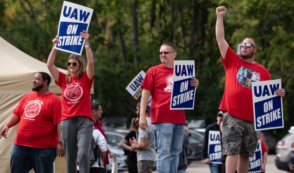 UAW Local 602 members picket Friday, Sept. 29, 2023,  in Delta Township, Michigan.