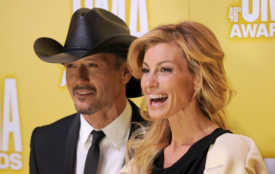 Tim McGraw, left, and Faith Hill arrive at the 46th Annual Country Music Awards at the Bridgestone Arena on Thursday, Nov. 1, 2012, in Nashville, Tenn. (Photo by Chris Pizzello/Invision/AP)