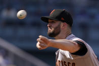 San Francisco Giants starting pitcher Alex Wood throws to the plate during the first inning of a baseball game against the Los Angeles Dodgers Saturday, July 23, 2022, in Los Angeles. (AP Photo/Mark J. Terrill)