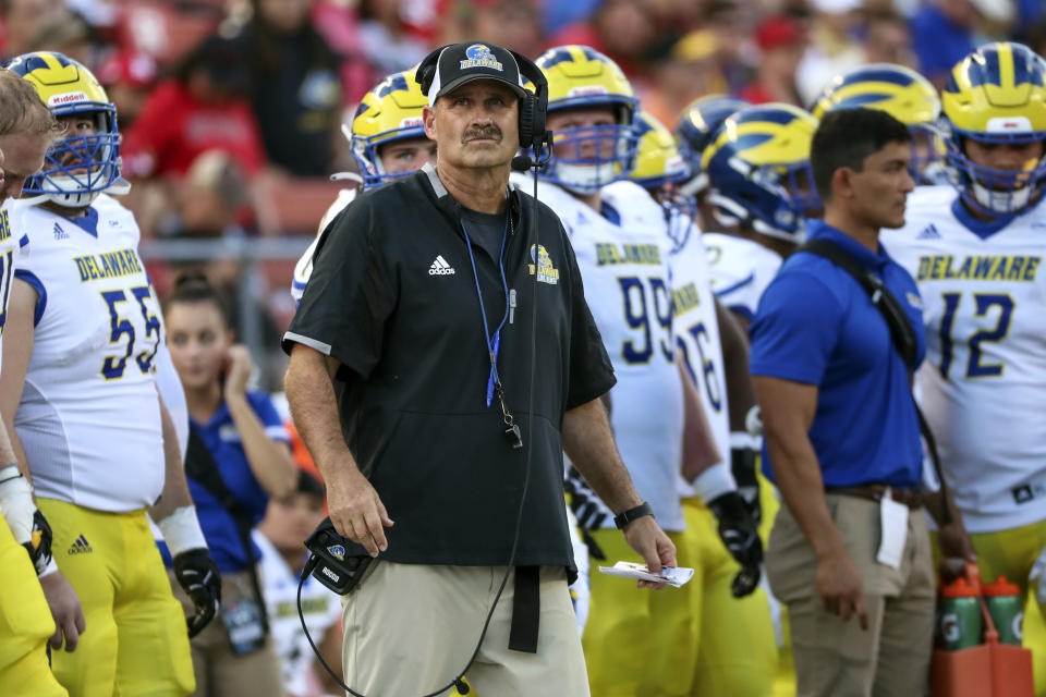 FILE - Delaware head coach Danny Rocco, center, watches from the sideline during the second half of an NCAA college football game against Rutgers, on Sept. 18, 2021, in Piscataway, N.J. Danny Rocco knows the job he's taken as the football coach at Virginia Military Institute will be harder than any of his three previous head coaching positions. (Andrew Mills/NJ Advance Media via AP, File)