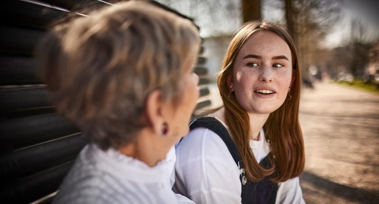 Teenage girl and older woman talking, represent divide in wellbeing. (Getty Images)