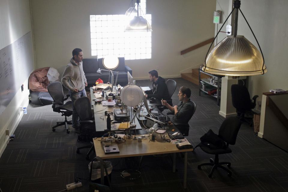 FILE - In this April 7, 2011, file photo, CEO Kevin Systrom, at left, chats with engineers Shayne Sweeney, center, and Mike Krieger at Instagram in San Francisco. In a statement late Monday, Sept. 24, 2018, Systrom said in a statement that he and Krieger, Instagram’s chief technical officer, plan to leave the company in the next few weeks and take time off “to explore our curiosity and creativity again.” (AP Photo/Marcio Jose Sanchez, File)