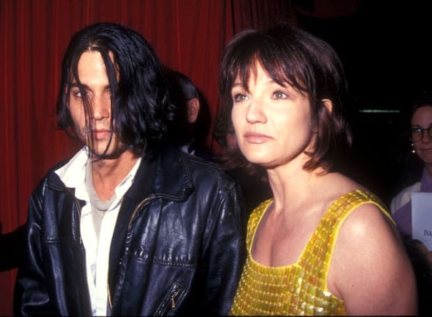 Johnny Depp and Ellen Barkin in 1994<p><a href="https://www.gettyimages.com/detail/82754013" rel="nofollow noopener" target="_blank" data-ylk="slk:Barry King/Getty Images;elm:context_link;itc:0;sec:content-canvas" class="link ">Barry King/Getty Images</a></p>