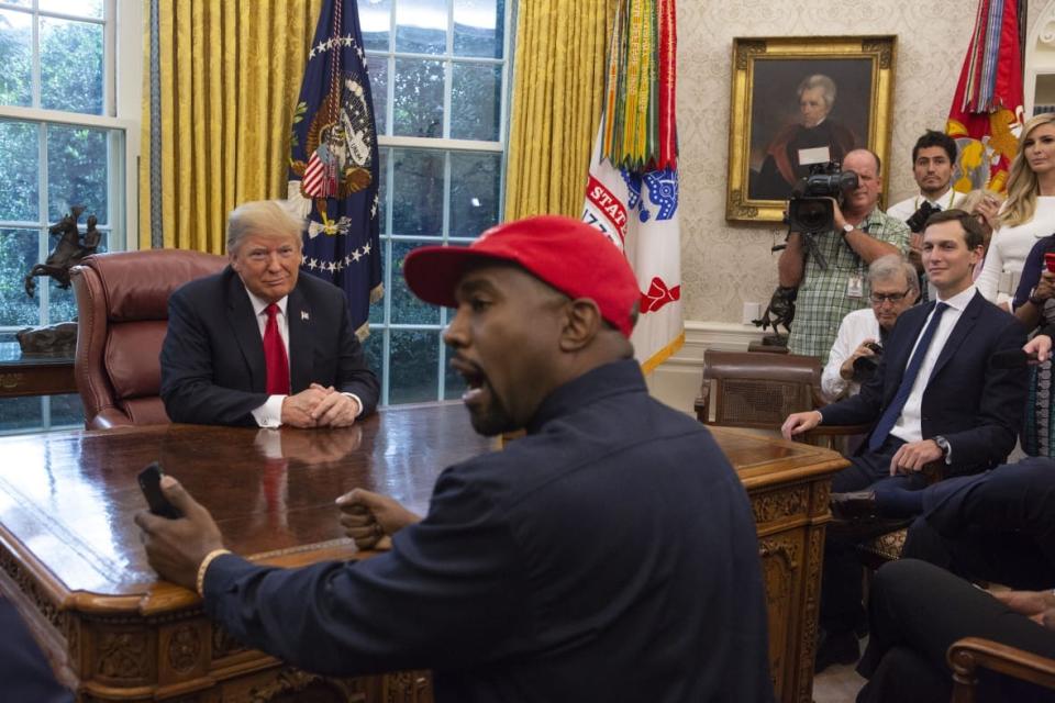 President Donald Trump meets with rapper Kanye West in the Oval Office of the White House in Washington D.C. on October 11, 2018. (Photo by Calla Kessler/The Washington Post via Getty Images)