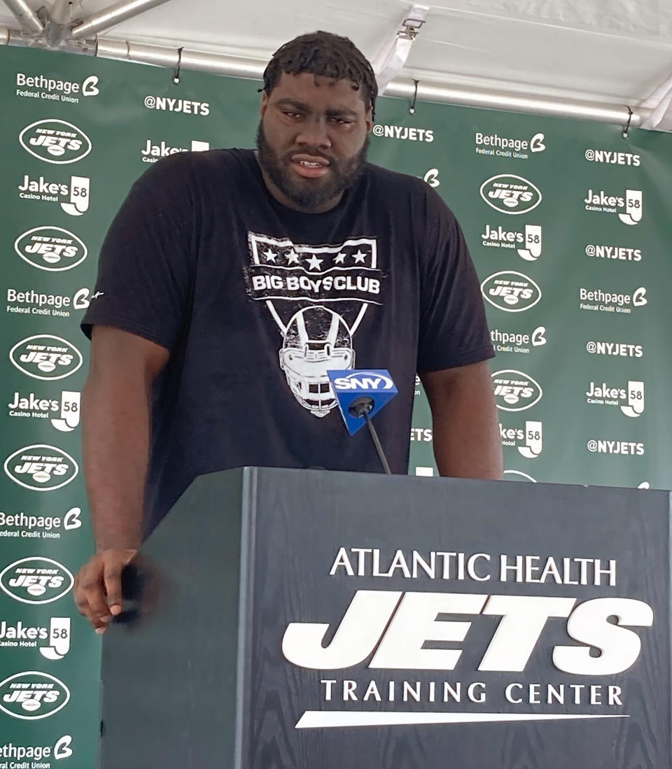New York Jets left tackle Mekhi Becton speaks to reporters at the team's NFL football training camp facility in Florham Park, N.J., Tuesday July 27, 2021. (AP Photo/Dennis Waszak Jr.)