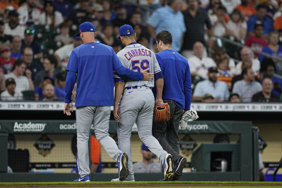 New York Mets starting pitcher Carlos Carrasco (59) leaves the field during the third inning of a baseball game against the Houston Astros Wednesday, June 22, 2022, in Houston. (AP Photo/David J. Phillip)