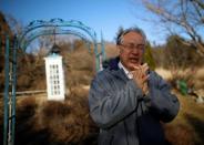 The Wider Image: Japan's tsunami survivors call lost loves on the phone of the wind