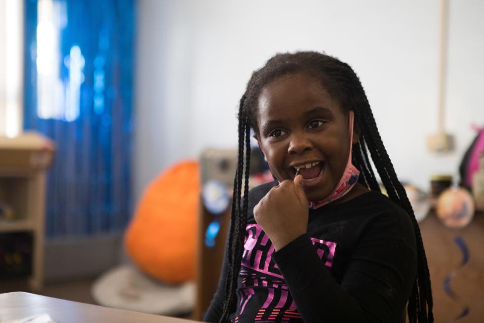 An EastSide Charter School student swabs her mouth for a saliva sample to be tested for COVID-19 Tuesday, Nov. 17 ,2020. EastSide Charter tests staff and students for COVID-19 on a weekly basis. 