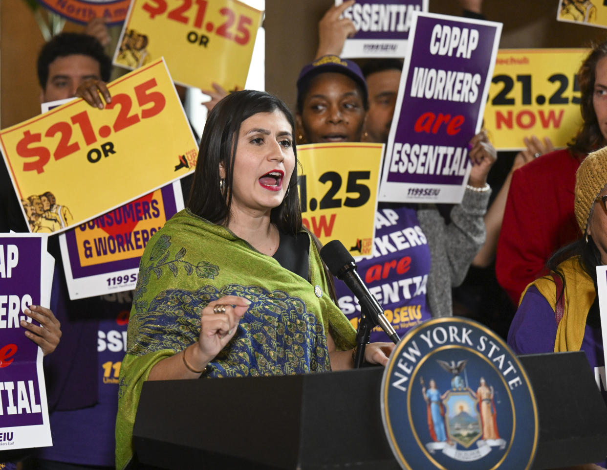 New York Sen. Jessica Ramos, D-East Elmhurst, stands with protesters urging lawmakers to raise New York's minimum wage during a rally at the state Capitol, Monday, March 13, 2023, in Albany, N.Y. (AP Photo/Hans Pennink)