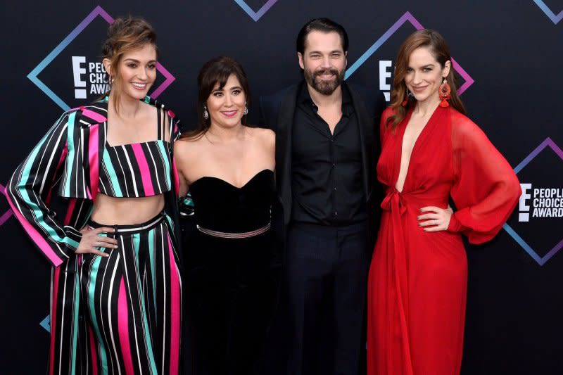 From left to right, Katherine Barrell, Emily Andras, Tim Rozon and Melanie Scrofano arrive for the 44th annual E! People's Choice Awards at the Barker Hangar in Santa Monica, Calif., in 2018. File Photo by Jim Ruymen/UPI