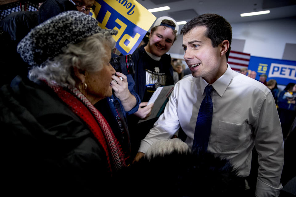 Democratic presidential candidate former South Bend, Ind., Mayor Pete Buttigieg, speaks with a member of the audience at a campaign stop at the Madison County Fairgrounds, Monday, Jan. 13, 2020, in Winterset, Iowa. (AP Photo/Andrew Harnik)