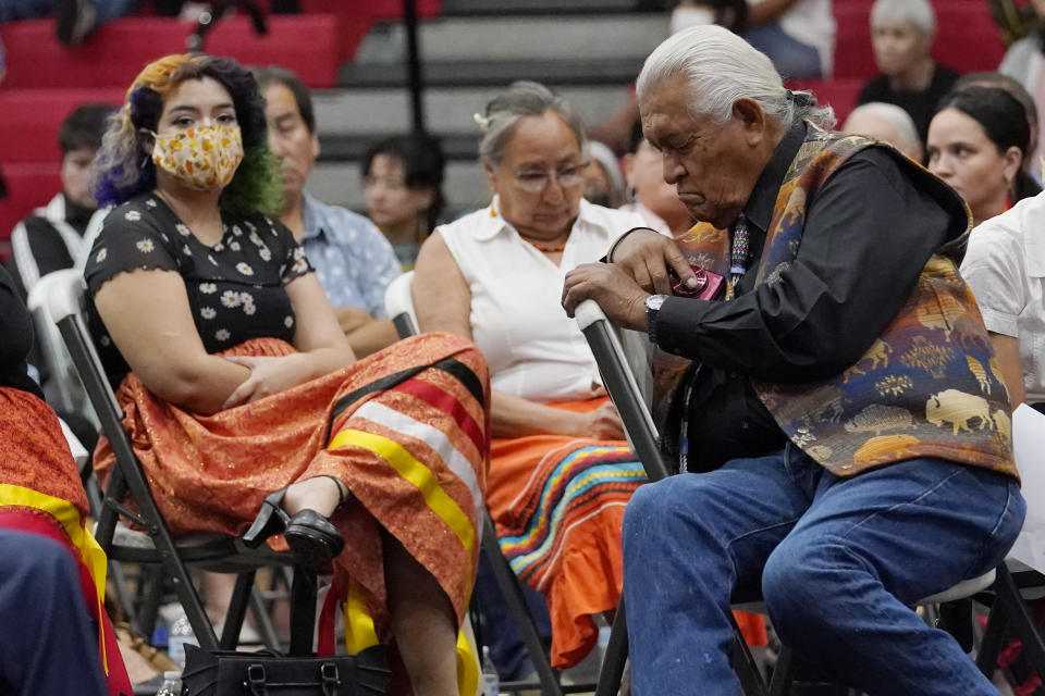 Ray Doyah, the first to speak on his experiences at an Indian boarding school, bows his head as he listens to others speak at a meeting to hear about the painful experiences of Native Americans who were sent to government-backed boarding schools designed to strip them of their cultural identities, Saturday, July 9, 2022, in Anadarko, Okla. One by one, Native American tribal elders who were once students at government-backed Indian boarding schools testified about the hardships they endured: beatings, whippings, sexual assaults, forced haircuts and painful nicknames. (AP Photo/Sue Ogrocki)