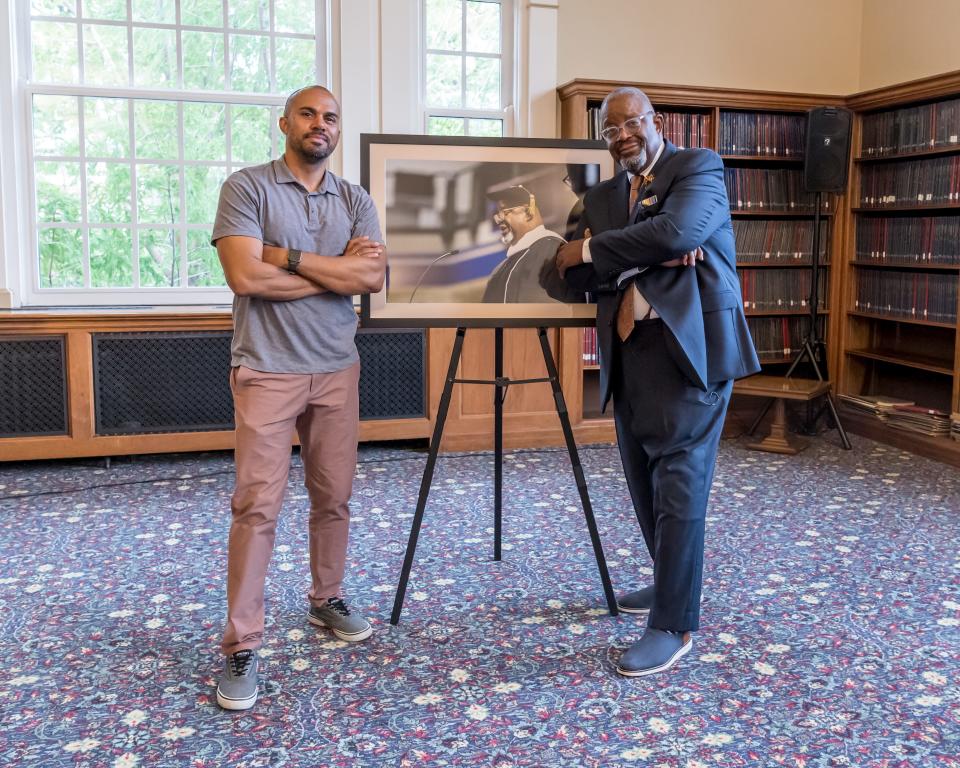 At right is Wayne Ford, a former state legislator and founder of the nonprofit social services agency Urban Dreams, and Izaah Knox, his successor as leader of the organization, during a ceremony May 19, 2022, at Drake University to unveil Ford's official portrait.