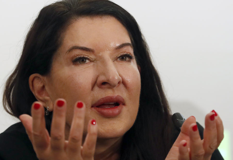 Performance artist Marina Abramovic gestures during the press conference for her art exhibition "Marina Abramovic - The Cleaner" in the Museum of Contemporary Art in Belgrade, Serbia, Saturday, Sept. 21, 2019. Abramovic is displaying her work in her native Belgrade for the first time in 44 years and she says that returning home has been highly emotional. (AP Photo/Darko Vojinovic)