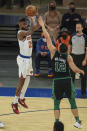 New York Knicks forward Reggie Bullock (25) shoots over Boston Celtics forward Grant Williams (12) during the second half of an NBA basketball game in New York, Sunday, May 16, 2021. (Vincent Carchietta/Pool Photo via AP)