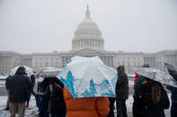 <p>Tourists visit the US Capitol during a snow storm in Washington, March 21, 2018. (Photo: Saul LoebA/AFP/Getty Images) </p>