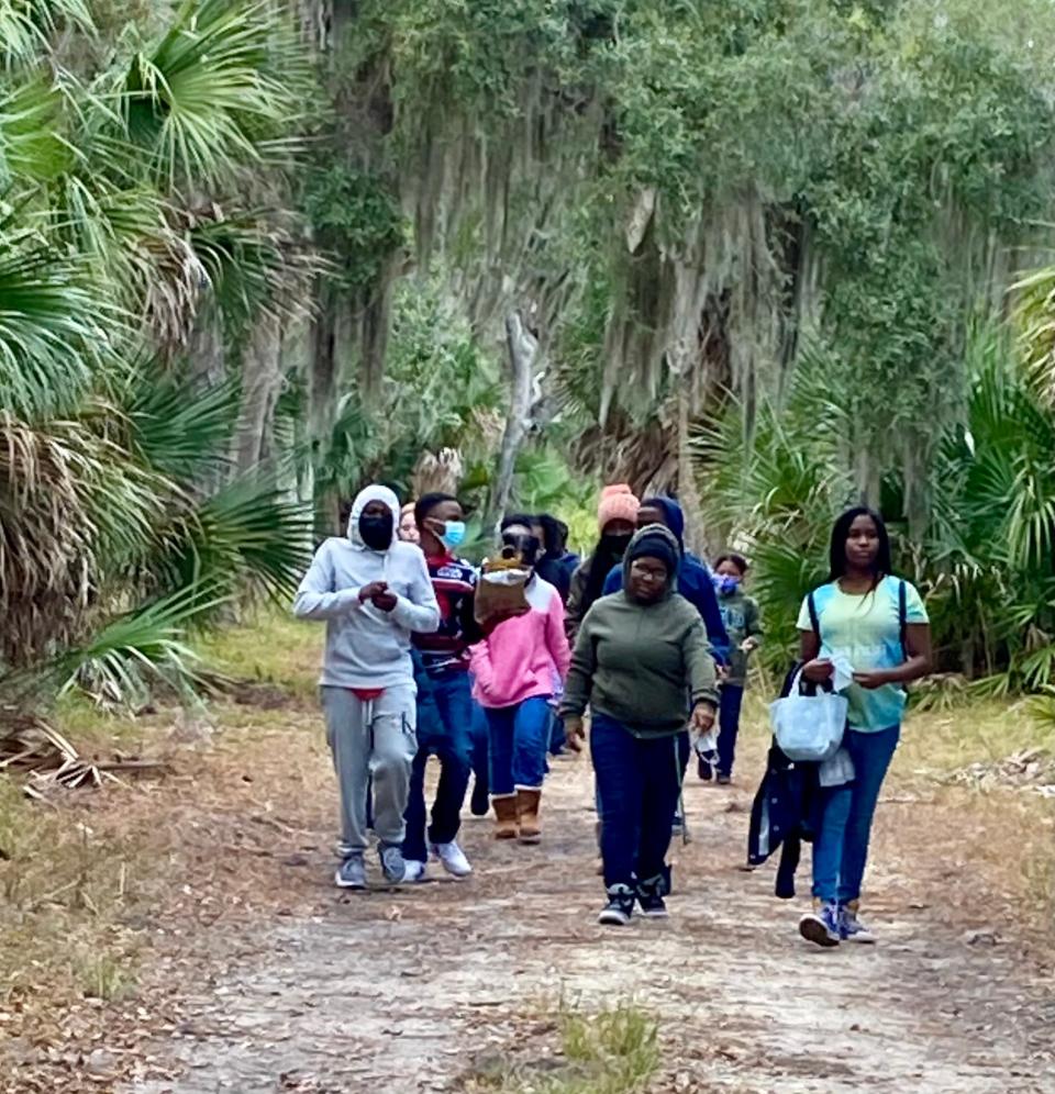 Oglethorpe Charter middle school students explore the forest of Ossabaw Island.