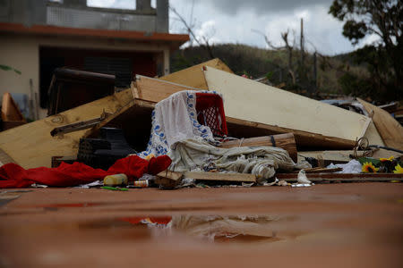 Debris is seen outside a home damaged by Hurricane Maria is seen in the Trujillo Alto municipality outside San Juan, Puerto Rico, October 9, 2017. REUTERS/Shannon Stapleton