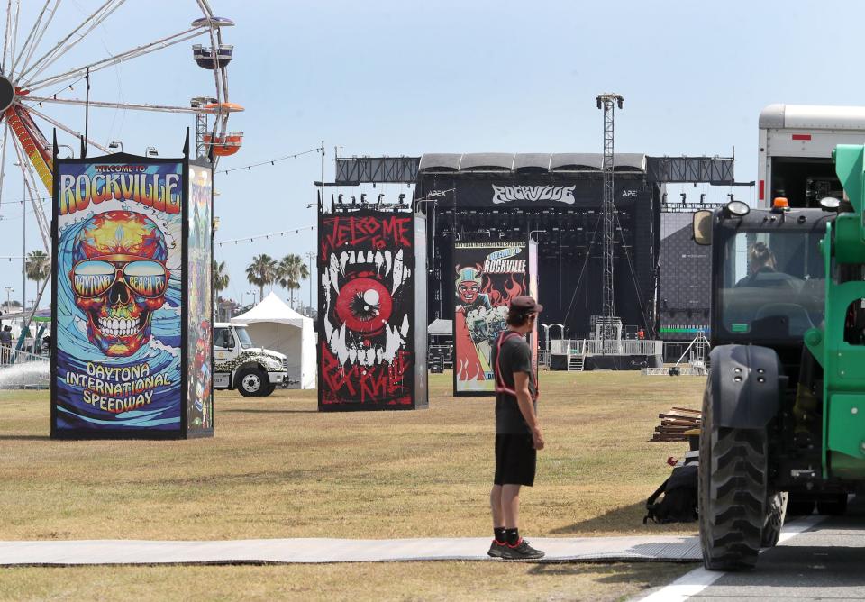 Workers and equipment fill the infield at Daytona International Speedway on Tuesday, as crews make final preparations for the Welcome to Rockville music festival. The four-day heavy metal fest will showcase at least 150 bands on five stages from Thursday-Sunday at Daytona International Speedway.