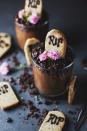 <p>You'd never guess that these decadent chocolate treats are fully vegan. For a fun activity, set up an interactive station, and let the kids decorate their own pots. </p><p><a href="http://wallflowerkitchen.com/nakd-graveyard-mousse-pots/" rel="nofollow noopener" target="_blank" data-ylk="slk:Get the recipe." class="link ">Get the recipe.</a> </p>
