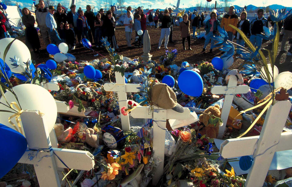 Flowers at a makeshift memorial for the 13 Columbine High School massacre victims in 1999. Source: Getty